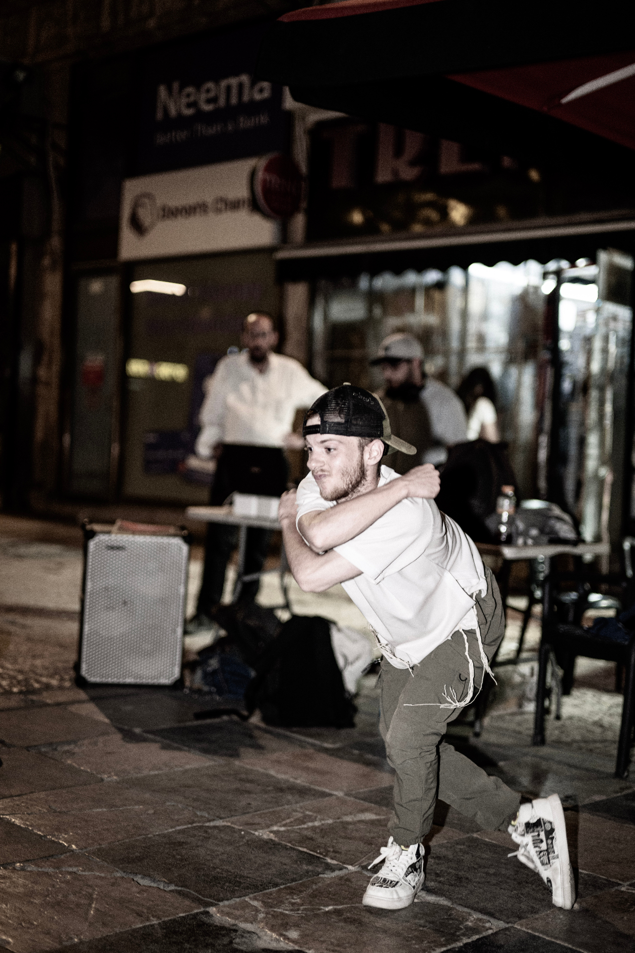 Street dancer downtown at night